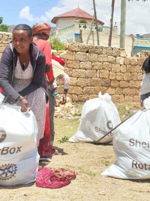 People holding bags with aid in Tigray, Ethiopia