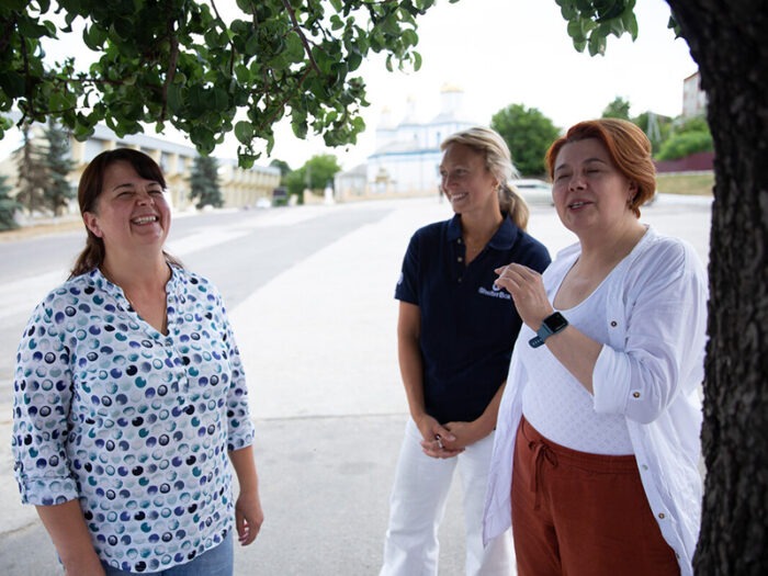 Three women laughing