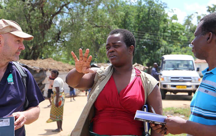 Three humanitarians talking in Malawi