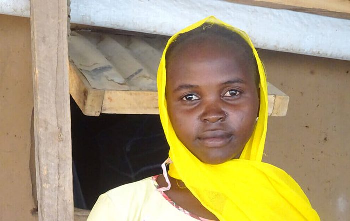 Girl wearing a yellow headscarf in Cameroon
