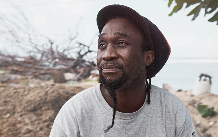 Portrait photo of a man wearing a red hat on Dominica in the Caribbean